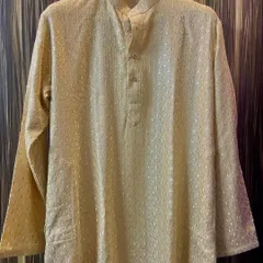 The same beige custom kurta shown in its full form. You can see the full-sleeve design and the comfortable, tailored fit that I create for each client.