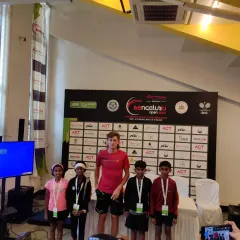 Our junior players standing with a professional athlete at the Bengaluru Open. These interactions are invaluable for inspiring the next generation of tennis stars.