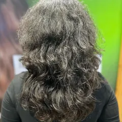 The "before" shot of a client ready for her caramel highlights transformation.