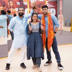 Posing with fellow instructors during our Dandiya event. We love bringing these cultural celebrations to the fitness world, making workouts feel like a festival.