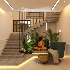 A similar under-stair concept, this time featuring a meditating Buddha statue. These custom interior landscape features add a unique, personalized touch and enhance the tranquil ambiance of a home.