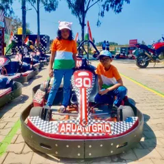 Decked out in the colors of the flag, these young racers are ready to celebrate their holiday on the track. It's a fun day out for the whole family.