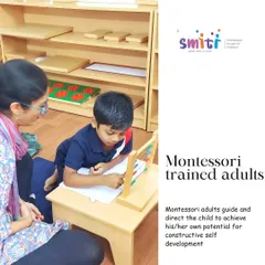 A Montessori-trained adult guides a child through an arithmetic exercise using the abacus. Our teachers act as facilitators, observing each child's needs and introducing new concepts when they are developmentally ready.