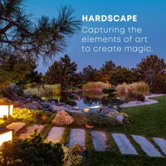 This image showcases hardscaping elements like stone pathways and subtle lighting integrated into a garden. These features not only provide practical access but also create a magical atmosphere, guiding the eye and inviting exploration, especially after dusk.