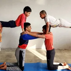 Strength and teamwork are built both in and out of the water. Our unique dry-land training includes acro yoga sessions that improve balance, core strength, and trust among our swimmers.
