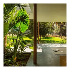 A covered verandah blurs the boundary between inside and out. This "in-between" space allows the residents to enjoy the garden and fresh air while being protected from the elements.