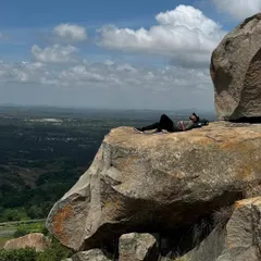 Finding a moment of peace and solitude on a rock ledge at Uttari Betta. The views of the surrounding landscape are incredibly rewarding.