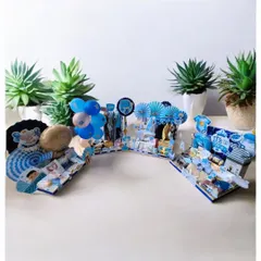 This is a wide view of a multi-part baby boy trousseau. It shows how I can create several coordinated hampers and displays to celebrate a newborn's arrival in a grand way.