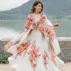 A twirl of happiness. The flowing, floral-printed lehenga was chosen for its beauty and movement, allowing the bride to feel free and joyful during her Haldi celebrations.