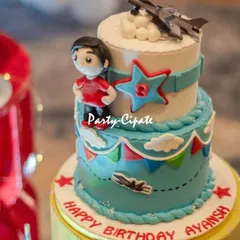 A close-up of the amazing fighter jet cake, complete with a little pilot figure and the birthday boy's age.