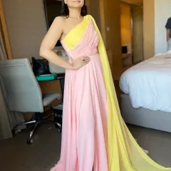 A full-length view of the client, showing how the natural makeup and hair complement her elegant and colorful gown. This style is perfect for daytime formal functions or professional speaking engagements.