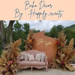 This "Better Together" neon sign against a rustic backdrop is a popular choice for photo booths at boho-themed weddings and engagements. The blush pink sofa adds a touch of softness to the earthy decor.