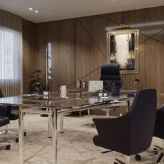 This conference room within an executive suite is designed for decision-making, featuring a sleek glass and chrome table surrounded by comfortable, professional seating. The wood-paneled walls add a sense of warmth and gravitas to the meeting space.