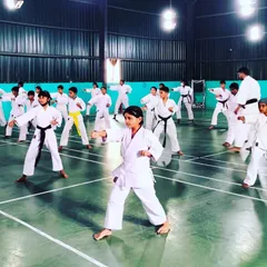 We foster focus and strong form in all our students. This young practitioner demonstrates a solid karate stance, showing the results of our emphasis on mastering the basics from an early age.