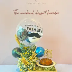For the weekend dessert hoarder, this hamper is a dream. It features a delicious cake, a festive balloon, and a beautiful floral arrangement, making it a complete celebration in a box.