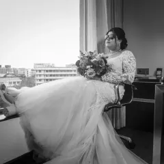 A moment of quiet reflection for the bride before the festivities begin. This unconventional, relaxed portrait in black and white tells a story of its own.