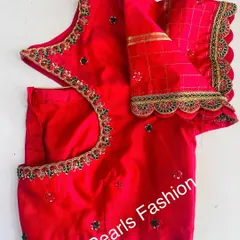 This red blouse has a simple but elegant design. It features a scalloped border with sequins and black stones along the neckline and sleeves.
