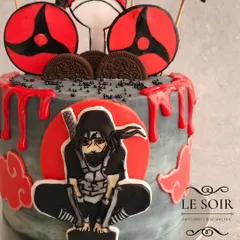 For all the anime fans, here's an Itachi Uchiha cake that was so much fun to design. This Milk & Cookies cake features a 2D fondant Itachi, his Sharingan, and a dramatic red and grey buttercream finish with a blood-drip effect.