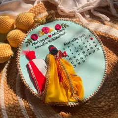 Another angle of this custom wedding hoop. The 3D effect of the bride's lehenga and the groom's sherwani makes it such a unique piece of art.