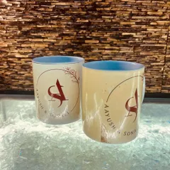 This shot showcases the back of the mugs, featuring a custom logo with the couple's initials. It’s these little details that make a personalized gift so special.