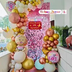 Another angle of the vibrant and sparkly baby girl welcome decoration.