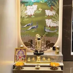 This sacred corner is dedicated to Shrinathji, featuring a stunning Pichwai art piece as the backdrop. I designed the multi-level platform in a clean, modern finish to beautifully contrast with the rich, traditional artwork. This setup shows how we can build a custom mandir space around a specific deity and art style that is special to you and your family.