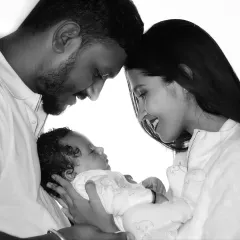 A quiet moment with your newborn is priceless. I use black and white photography to capture the deep, emotional connection between parents and their new baby, creating a timeless family heirloom.