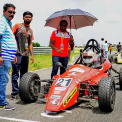 A pre-race moment on the grid, where our team ensures both the driver and the Formula LGB car are perfectly prepared for the competition ahead.