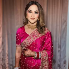 Reception-ready with soft curls and glowing makeup. This look is perfect for a bride who wants to look glamorous yet feel comfortable.