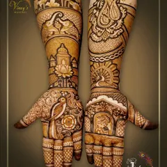 A full view of the stunning mehndi we did for the groom's sister. The design is asymmetrical, with one hand featuring a portrait and the other a beautiful paisley motif.