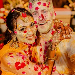 The happy chaos of a Haldi, captured perfectly. Our decor, featuring vibrant flowers and traditional elements, sets the stage for these unforgettable, fun-filled memories.