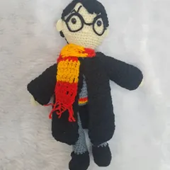 For all the magic lovers, here is my handmade Harry Potter doll. He comes complete with his glasses, Gryffindor scarf, and Hogwarts robe.