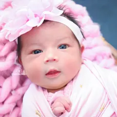 Look at those beautiful blue eyes. I love capturing moments when babies are awake and alert, showing their budding personality.