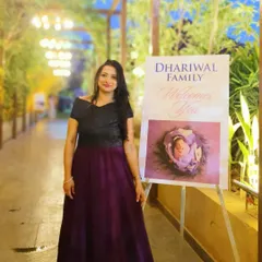 Standing by the welcome sign at a baby naming ceremony in Pune. The elegant decor and personalized touches create a warm and inviting atmosphere for celebrating a new arrival.