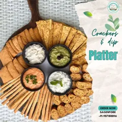 My crackers and dip platter is a crowd-pleaser. It features four of my most-loved dips surrounded by an array of breadsticks, crackers, and crisps, all beautifully arranged on a wooden board.