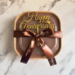 My Tiramisu is perfect for any occasion, including anniversaries. Here it is, beautifully packaged and ready for gifting with a custom "Happy Anniversary" topper.
