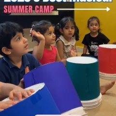 It's never too early to start a musical journey. This image from our musical summer camp shows toddlers engaged in a rhythm activity with colorful bucket drums, showcasing our focus on making music accessible and fun for children as young as three.