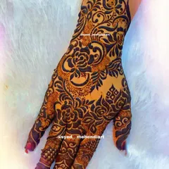 A heavy designer piece with a focus on intricate floral and paisley work.