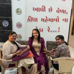 A candid moment during a mehndi session. Here I am with my team member, applying henna for a lovely bride. We always make sure our brides are comfortable and happy.