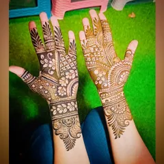 A unique design where one hand features bold, negative-space florals while the other has more traditional patterns.