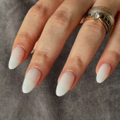 A close-up showing the soft, semi-sheer finish of these milky white extensions.
