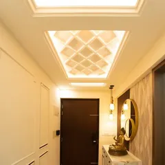 This foyer at Pashmina Waterfront uses a beautifully backlit coffered ceiling to add warmth from above. A floating console with a Buddha idol brings a sense of peace.