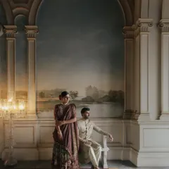 A portrait of Uha and Ravi at the Taj Falaknuma, framed like a classical painting. The palace's art and architecture provide a backdrop that is as timeless as their love.