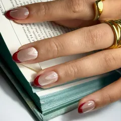 This is the French manicure, upgraded. I created this look using a glassy maroon cat eye polish for the tips, giving the classic design a deep, magnetic shine that turns heads.