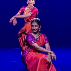 This pose from a duet showcases the use of different levels and complementary postures. I design my choreography to be visually dynamic, using the entire stage space.