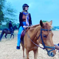A casual rider enjoying a lesson in our arena. It doesn't matter if you've never touched a horse before; I am here to guide you at your own pace.