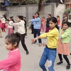 A group of girls learning basic self-defense stances. Building muscle memory for these stances is a key part of the training.