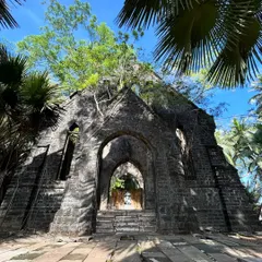 The ruins of an old church on Ross Island, Andaman. Nature has taken over these British-era structures, creating a unique and hauntingly beautiful landscape.