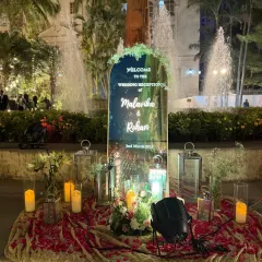 A personalized welcome to Malavika and Rohan's wedding reception. We created this beautiful mirrored sign, surrounded by candles and lanterns, set against the backdrop of a lovely water fountain.