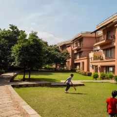 Public space held by buildings is a core tenet of my work. At JSW Vidyanagar, the residential blocks are arranged to form a protected central green, a safe and expansive play area that becomes the heart of the community.